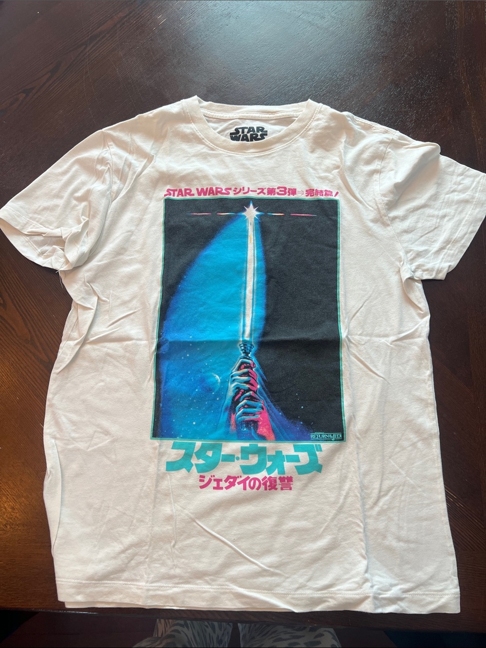 Star Wars White Graphic Tee with Blue Lightsaber and Pink Accents